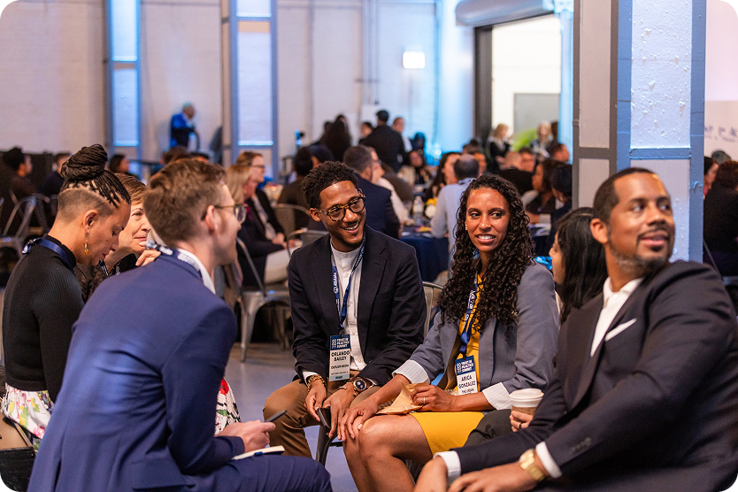 5 people engaged in discussion at a summit