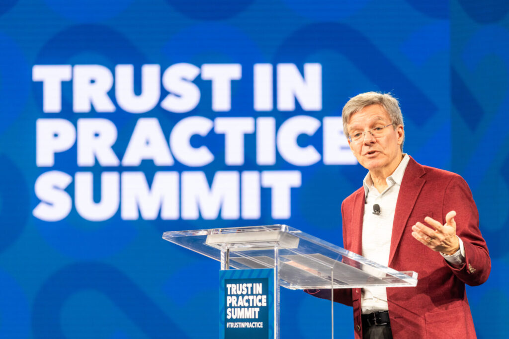 Speaker gesturing while presenting on stage