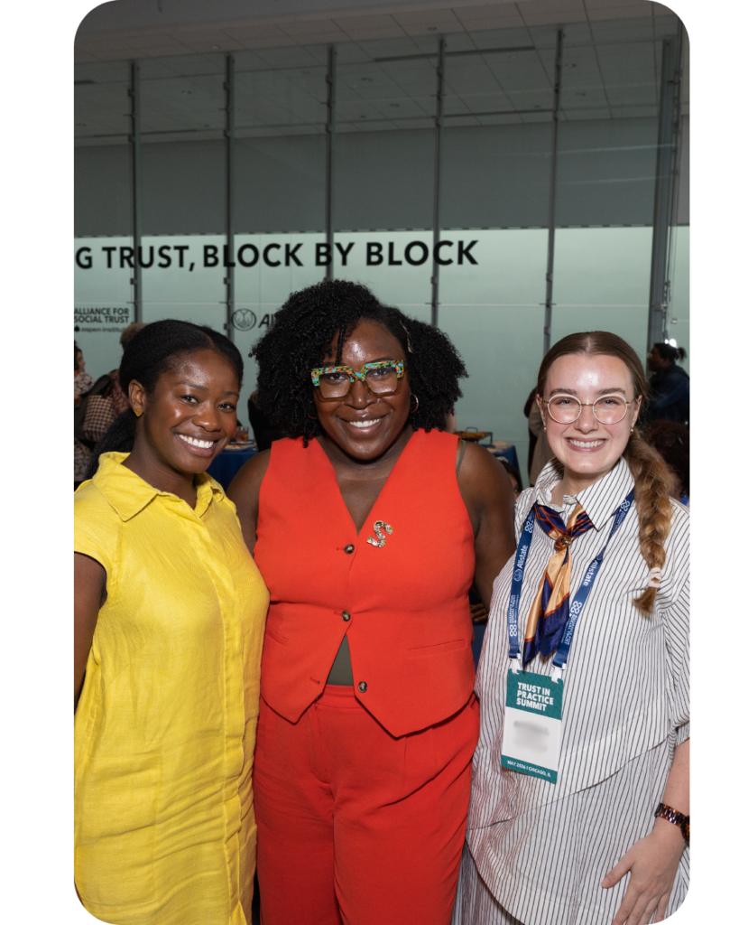 Three women smiling